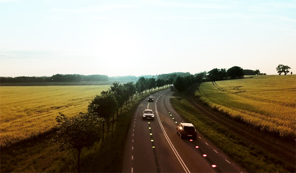 Highway with cars driving over Elonroad's charging rails